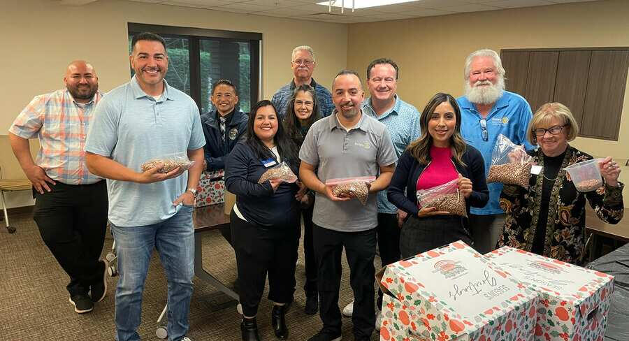 Volunteers bringing the holiday cheer with their Annual Rice and Beans Packing Event - Rotary Norwalk / Santa Fe Springs