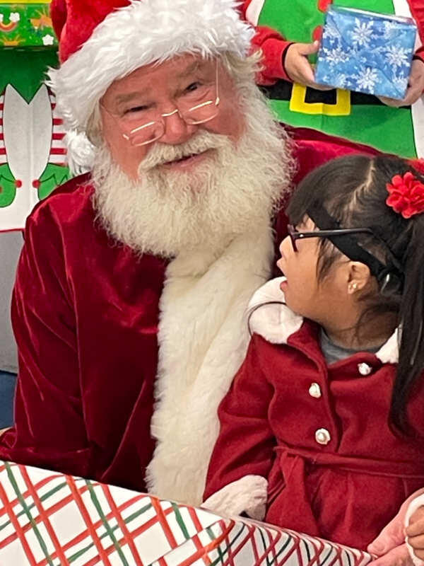 Santa and a kid at Nuffer Elementary